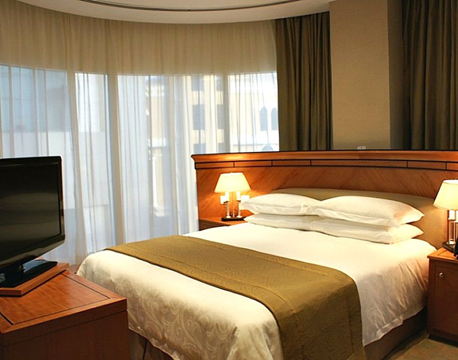 Wiseman Grand Hotel Доха Экстерьер фото A bedroom in a hotel